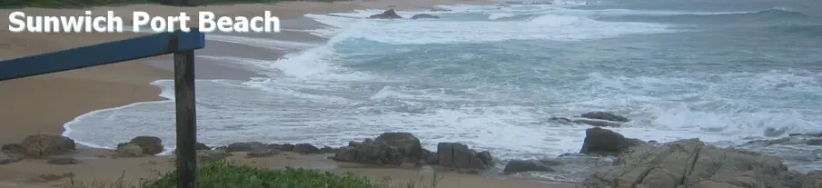 Sunwich Port Beach KZN South Coast rocks with beach sand and surf